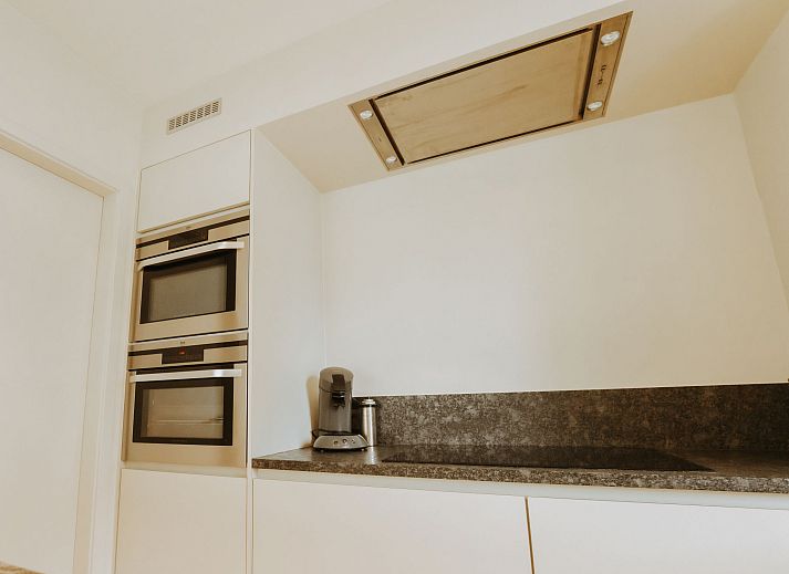 Attractive bedroom in Apartment Goethe, De Haan, Belgian coast, with comfortable bed and natural light for optimal relaxation.