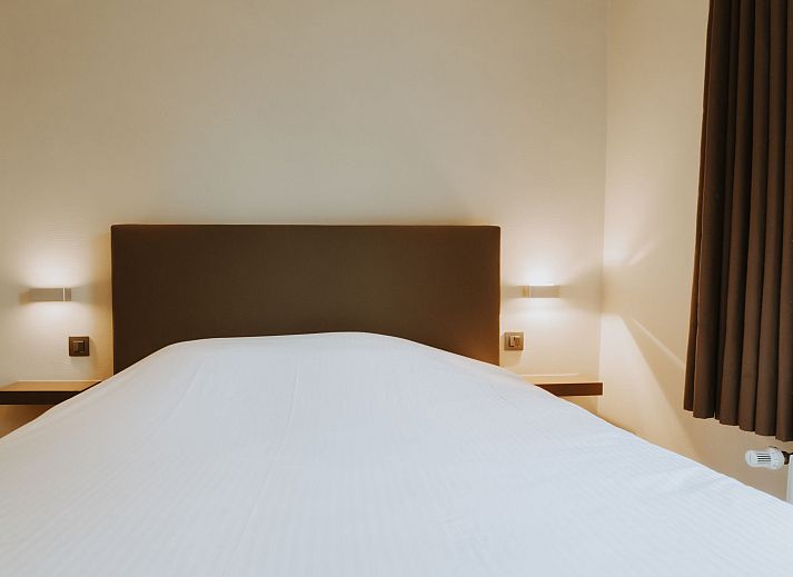 Attractive bedroom in Apartment Goethe, De Haan, Belgian coast, with comfortable bed and natural light for optimal relaxation.