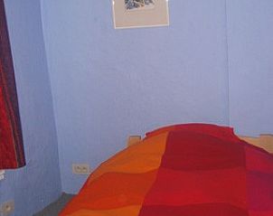 Colorful bedroom in Frances Milton, vacation accommodation Bruges, Belgium.