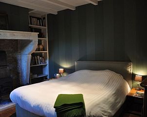 Bright double bedroom in Balsemboom Brugge vacation home, Bruges, West Flanders with wooden interior.