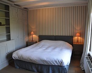 Spacious bedroom with double bed in Balsemboom Brugge vacation home, Bruges, West Flanders.