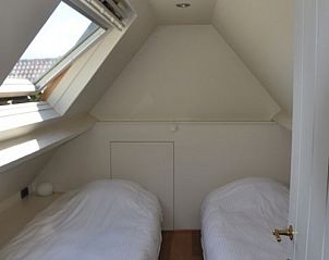 Cozy attic room with two beds in Balsemboom Brugge vacation home, Bruges, West Flanders.