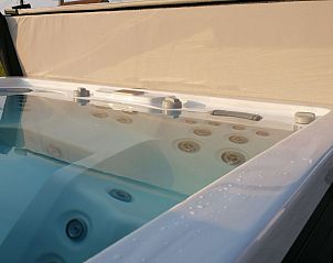 Relax in the luxurious jacuzzi at Holiday home Ferienvilla 'Wellness Akkerland' in Zonnebeke, West Flanders, ideal for a restful vacation.