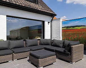 Enjoy the sunny terrace of Holiday home Ferienvilla 'Wellness Akkerland' in Zonnebeke, West Flanders, with stunning views.
