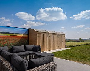 Enjoy panoramic views from the terrace of Holiday home Ferienvilla 'Wellness Akkerland' in Zonnebeke, West Flanders.