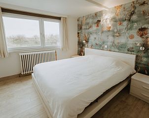 Attractive bedroom in Apartment Residence Du Parc with sea view in De Haan, West Flanders, Belgium.