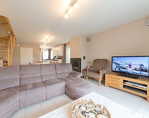 Cozy living room in Holiday home Boonenhove nr.57 with comfortable seating area, located in De Haan, West Flanders, ideal for relaxation.