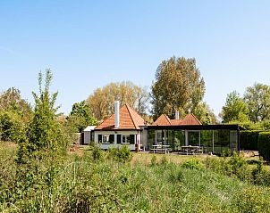 Charmantes Ferienhaus Rue de labbaye in Koksijde, Belgien, umgeben von ppiger Natur und rustikaler Umgebung.