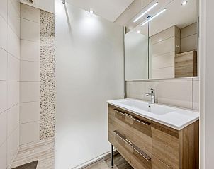 Modern bathroom in Azcona Two vacation home, Koksijde, West Flanders with stylish sink and spacious shower.