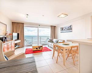 Cozy living room in vacation home Les Petrels sixth, Koksijde, with sea view and modern decor in West Flanders, Belgium.