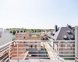 View from the terrace of Lysa fourth, a vacation home in Koksijde, West Flanders, with panoramic views of the town and surrounding nature.