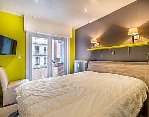 Cozy bedroom in vacation home Zeezicht GV, Koksijde, with modern decor and views of the surroundings of West Flanders.