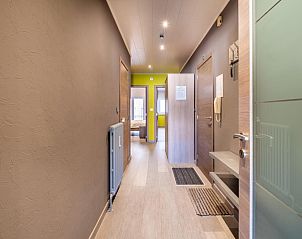 Bright hallway in vacation home Zeezicht GV in Koksijde, West Flanders, with modern furnishings and access to bedrooms.