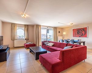 Cozy living room in Paco Fourth vacation home, Koksijde, with modern decor and comfortable seating area in West Flanders, Belgium.