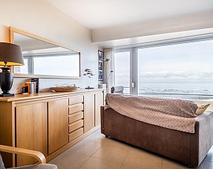 Cozy living room of Vitelli fourth vacation home in Koksijde, West Flanders with panoramic sea views and modern furnishings.
