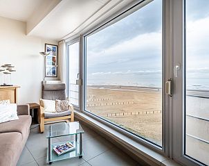 Enjoy panoramic sea views from the living room of Vitelli fourth, a vacation home in Koksijde, West Flanders, Belgium.