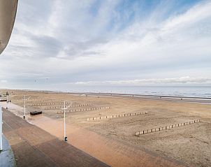 Beach view at Vitelli fourth vacation home in Koksijde, West Flanders, with panoramic sea views and vast sandy beaches.