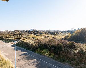 Uitzicht op de duinen vanuit Vue Dunes vakantiehuis in Koksijde, West-Vlaanderen, Belgi, omgeven door natuurlijke schoonheid en serene landschappen.