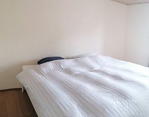 Spacious bedroom with double bed in maison Miest vacation home in Watou, West Flanders.