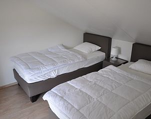 Comfortabele slaapkamer met twee bedden in Vakantiewoning Zee en Polder nr. 138, Westende.