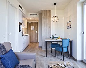 Modern interior space of Spacious Suite | 2p in Zeebrugge, West Flanders, Belgium with stylish decor and fully equipped kitchenette.