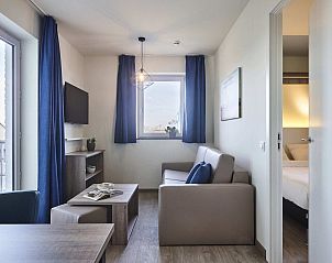 Modern living room of Spacious Suite | 2p in Zeebrugge, West Flanders. Comfortable vacation home with views and stylish decor.