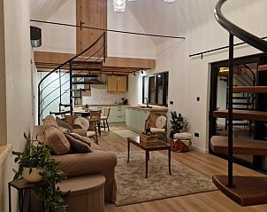 Cozy interior of Huisje in Ruiselede, a vacation home in West Flanders, Belgium, with a modern kitchen and stylish living room.