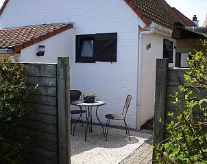 Cozy nook with seating at cottage for 6 in Bredene, West Flanders, perfect for coffee.