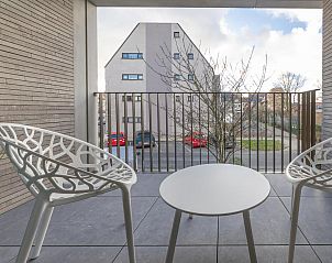 Relax on the terrace of vacation home Castor - 0102 in Middelkerke, West Flanders, overlooking the quiet street and modern architecture.