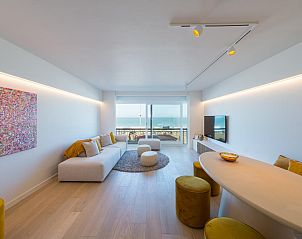 Stylish living room in vacation home Jamani - 0101 in Middelkerke, West Flanders, with sea view and modern furnishings.