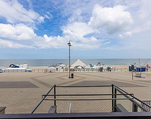 Sea view from vacation home Jamani - 0101 in Middelkerke, West Flanders, with beach and blue sky in the background.