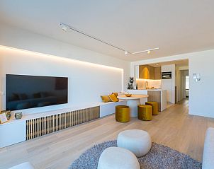 Modern living room of vacation home Jamani - 0101 in Middelkerke, West Flanders with stylish decor and open kitchen.