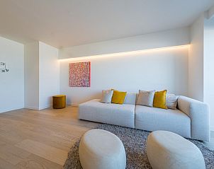 Cozy living room in vacation home Jamani - 0101, Middelkerke, with modern interior and comfortable seating area in West Flanders, Belgium.