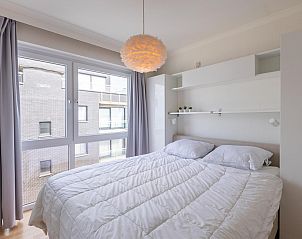 Bright bedroom in vacation home Kwintebank - 0904 in Middelkerke, West Flanders, Belgium with large window and comfortable double bed.