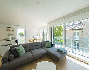 Bright living room in vacation home Matisse - 0101 box 8, Middelkerke, West Flanders, with modern decor and garden view.