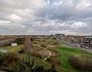 View from Apartment Studio 502 in Bredene, West Flanders, Belgium, featuring green parks and urban surroundings.