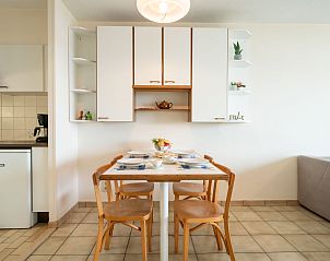 Cozy dining area in Apartment Residentie Astrid, Bredene, West Flanders. Enjoy a comfortable vacation in this cozy apartment.