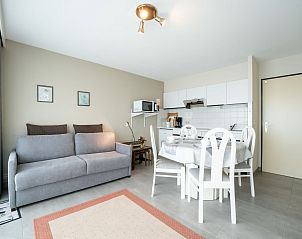 Cozy interior space of Apartment Ref. 704 in Bredene, West Flanders, with modern kitchen and comfortable sitting area.