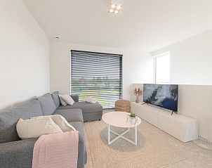 Cozy living room in Holiday Home De Garnaal, Bredene, with modern interior and spacious views of the nature of West Flanders, Belgium.