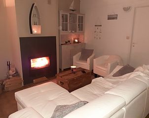 Cozy living room with fireplace in Holiday home Oostduinkerke, Belgian coast.