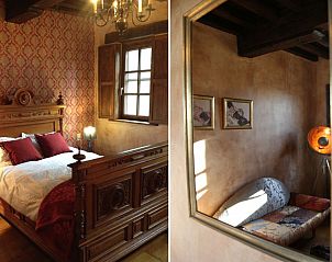 Klassieke slaapkamer in Trumpet House vakantiehuis in Kessel-Lo, Vlaams-Brabant, Belgi, met houten meubels.