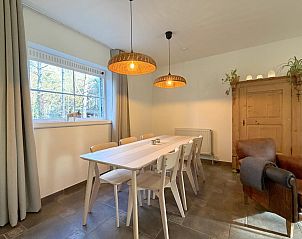 Stylish living room of Lierelodge vacation home in Oud-Turnhout, Antwerp, overlooking the terrace and surrounding nature.