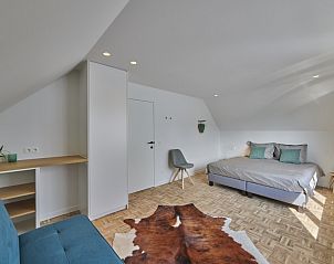 Spacious bedroom in Sahara119, vacation home in Lommel, Limburg with comfortable double bed.