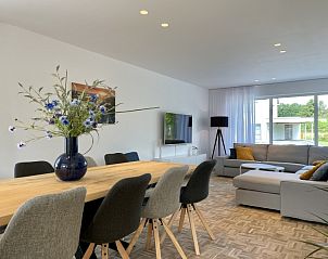 Cozy living room of Sahara119 in Lommel, Limburg with spacious sitting area and dining table.