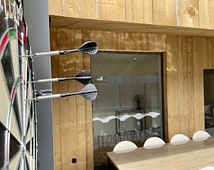 Dartboard on the terrace of Sahara119, vacation home in Lommel, Limburg for entertainment.