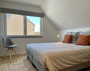 Bedroom in Sahara119, vacation home in Lommel, Limburg with a view of the surroundings.