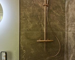 Modern shower in Villa Bosrijk, vacation home in Lommel, Limburg, with luxury finishes.