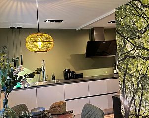 Modern kitchen in Cottage in Lanaken, vacation home in Limburg, Belgium, with stylish decor and natural accents.