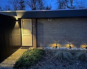 Illuminated entrance to Cottage in Lanaken, an attractive vacation home in Lanaken, Limburg, Belgium, surrounded by natural beauty.