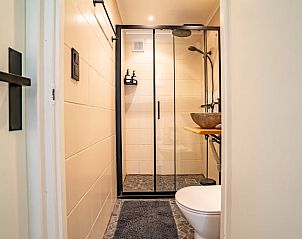 Modern bathroom in Holiday home in Lanaken, Limburg. Comfortable accommodation in Belgium with stylish shower and sink.